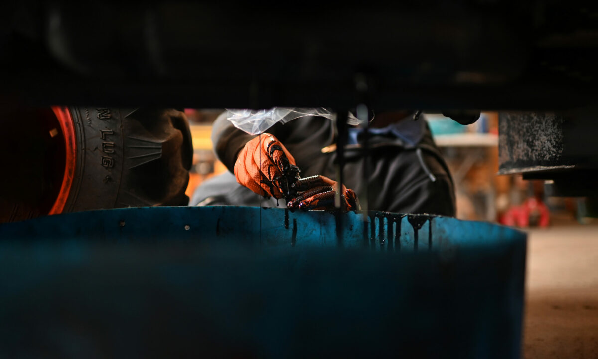 Alejandro Arellano works on getting a Kubota tractors ready for harvest season at Bedrock Vineyard in Glen Ellen. (Erik Castro/for Sonoma Magazine)