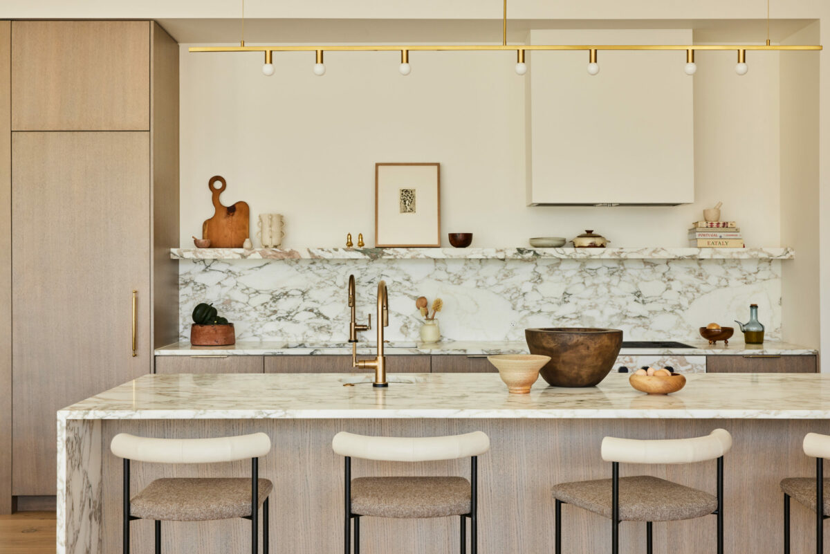 Marble surfaces offer a gorgeous counterpoint to blonde woods. (Nicole Franzen)