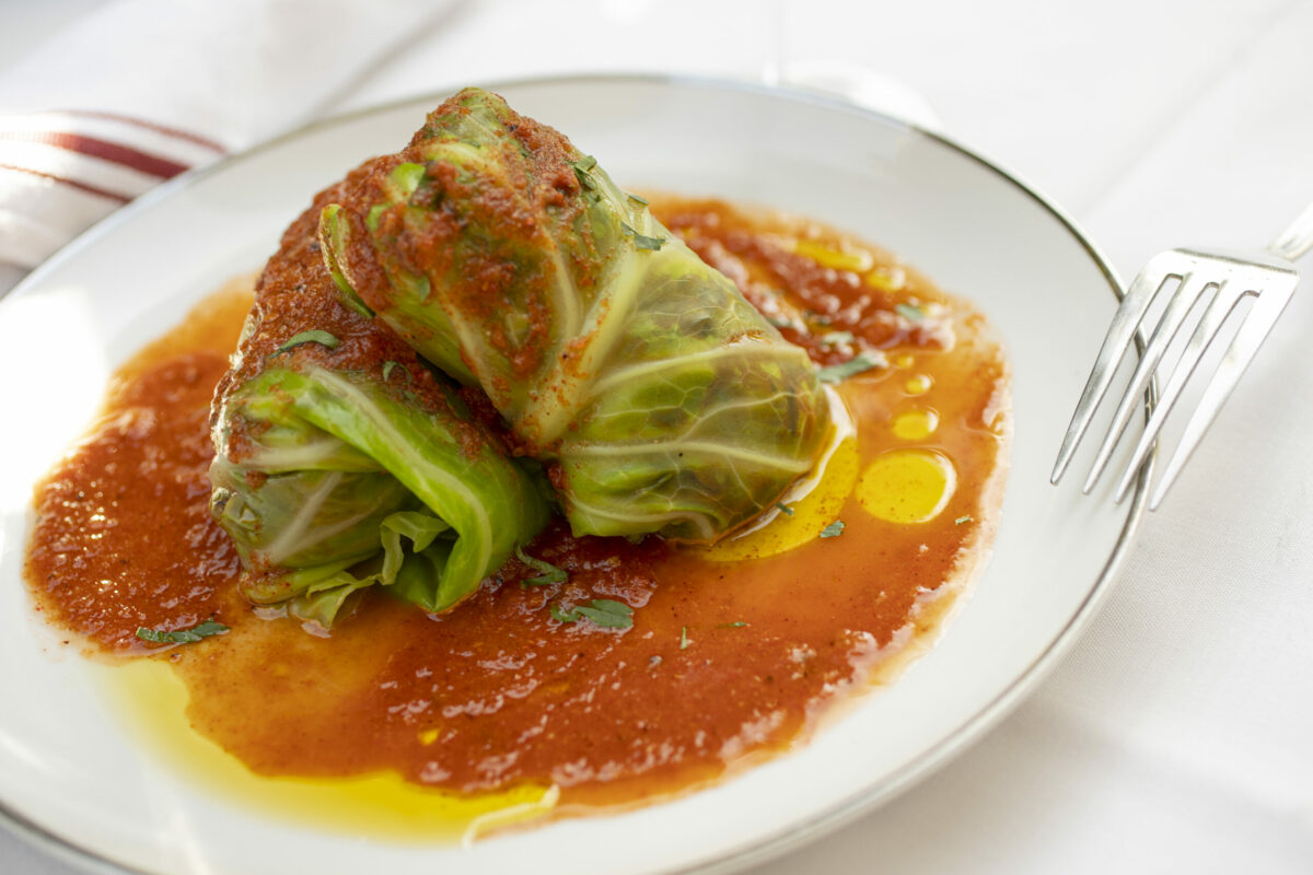 Middle Eastern Stuffed Cabbage with caramelized eggplant-baharat tomato broth, Beyond Beef, cremini and shiitake mushrooms, basmati rice, pomegranate molasses, ras el hanout and baharat spices, and tomato sauce at La Bodega Kitchen in Sebastopol. (Chad Surmick / The Press Democrat)