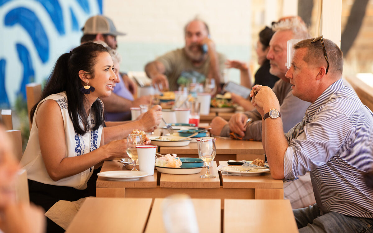 Amy Gallagher, left, and Mark Bodenhamer with the chamber of commerce try out the new Valley Swim Club restaurant on opening day in Sonoma, Tuesday, Oct. 3, 2023. (John Burgess / The Press Democrat)
