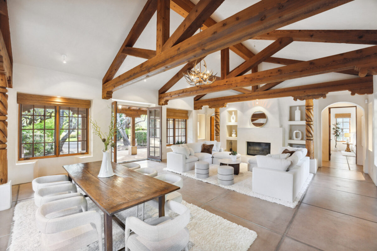 Built in 2000, the home has Hacienda-style design elements: a clay tiled roof, wood beams and doors, arched hallways, wrought-iron lamps, and a courtyard. (Open Homes Photography / Sotheby's International Realty)