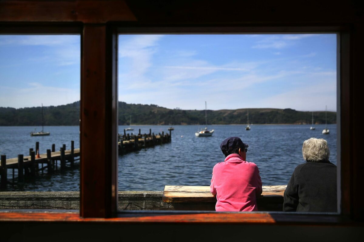 Jessica Faraday, left, and Jutta Diemath enjoy the view at The Marshall Store, in Marshall, on Wednesday, August 26, 2015. (Christopher Chung / The Press Democrat)