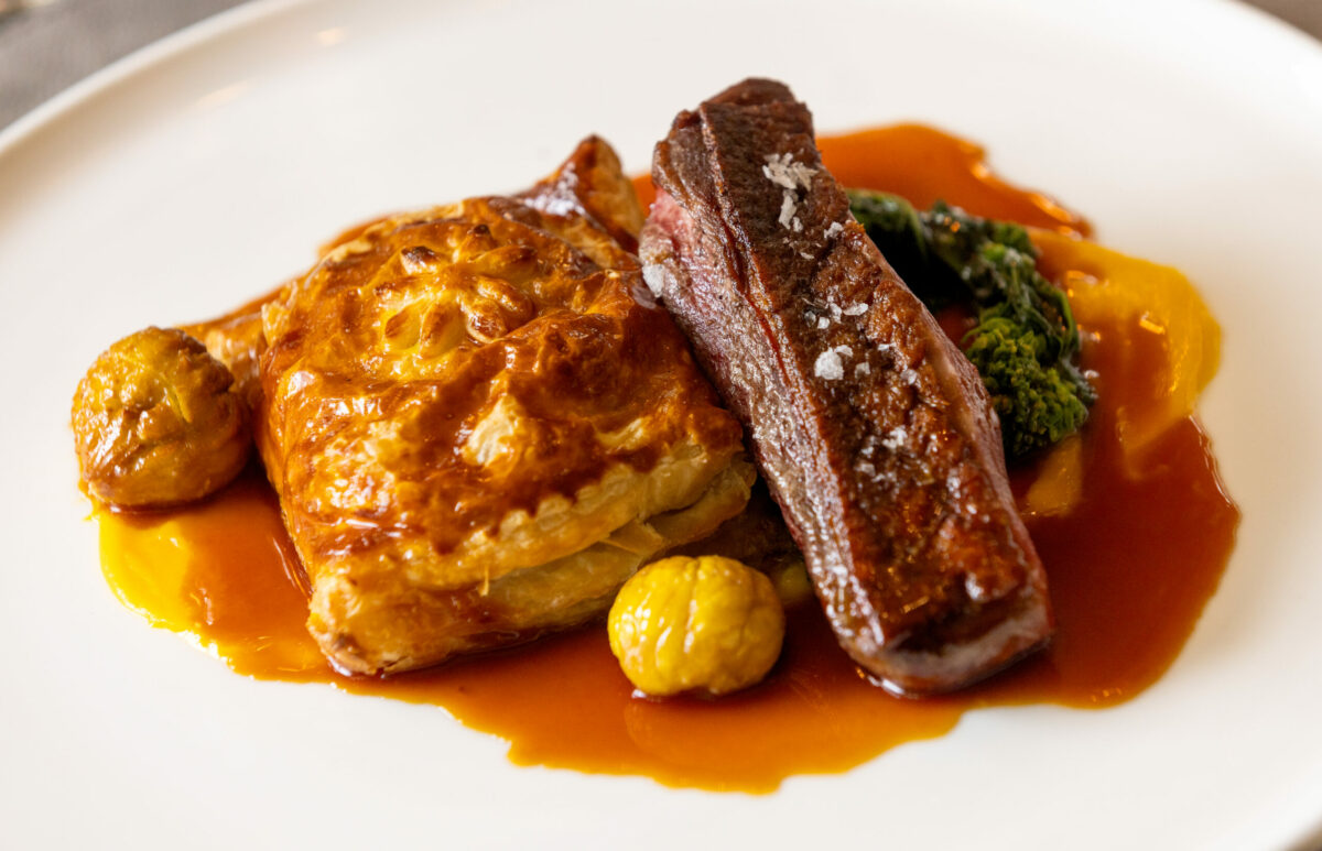 Liberty Farms Duck Breast with leg en croute, koginut squash, roasted chestnuts, rapini and a l’orange jus from the Dry Creek Kitchen Thursday, November 2, 2023 in Healdsburg. (Photo John Burgess/The Press Democrat)