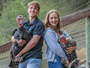 Siblings Ella and Nico Bartolomei have been involved with 4-H for several years. Ella says the turkeys calls often make her laugh. (Chad Surmick/The Press Democrat)