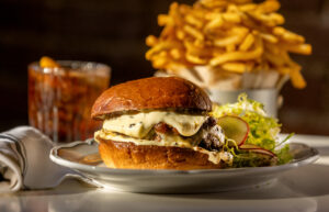 Prime Burger Royale with comté cheese, onion marmalade, truffle mayo on a brioche bun with frites from Augie’s French Tuesday, November 28, 2023 on Courthouse Square in Santa Rosa. (Photo John Burgess/The Press Democrat)