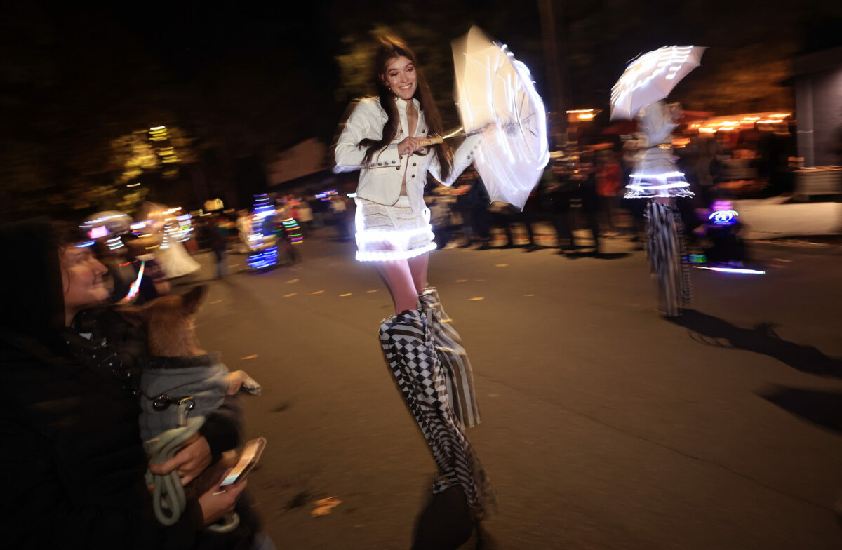 Stilt walkers Juna Barricklow and Krysta Cook of Santa Rosa participate in Winterblast in the SOFA district of Santa Rosa, Saturday, Nov. 6, 2021. (Kent Porter / The Press Democrat) 2021