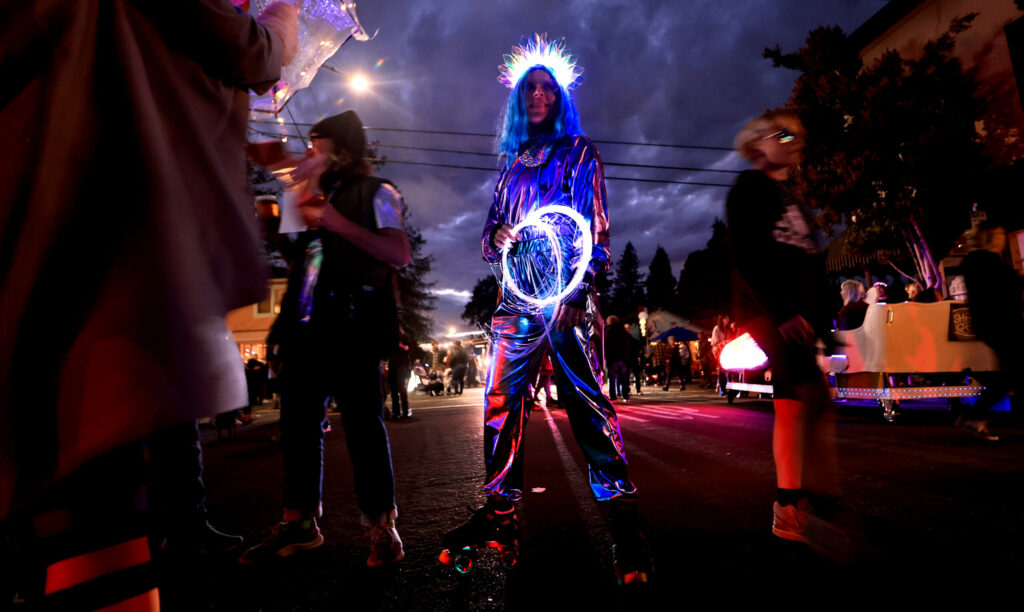 Heather Murray of Santa Rosa wears her best spacesuit for a roller skating trek on the WinterBlast parade route in the SOFA arts district in Santa Rosa, 2023. (Kent Porter/The Press Democrat)