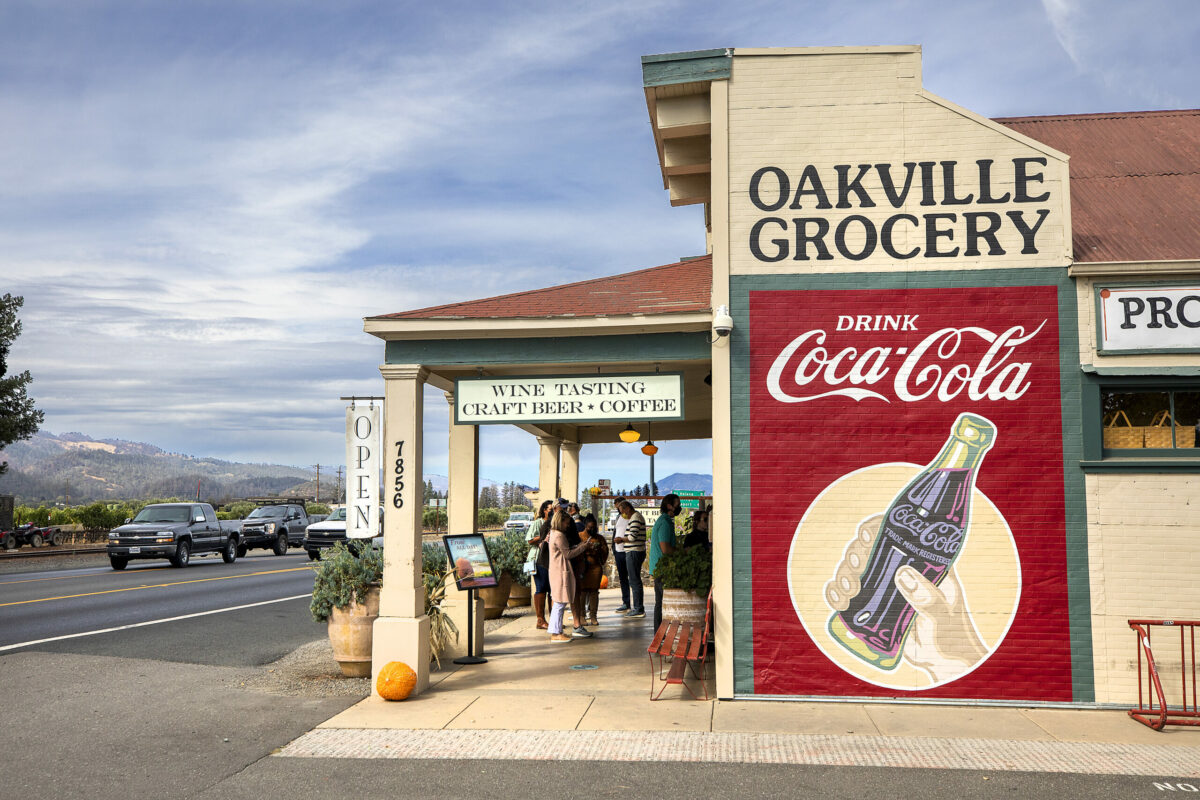 The Oakville Grocery has nourished locals and tourists in the middle of the Napa Valley for 140 years. A long line of customers wait outside for their chance to enter the bustling boutique store on Wednesday, October 6, 2021. (Photo by John Burgess/The Press Democrat)