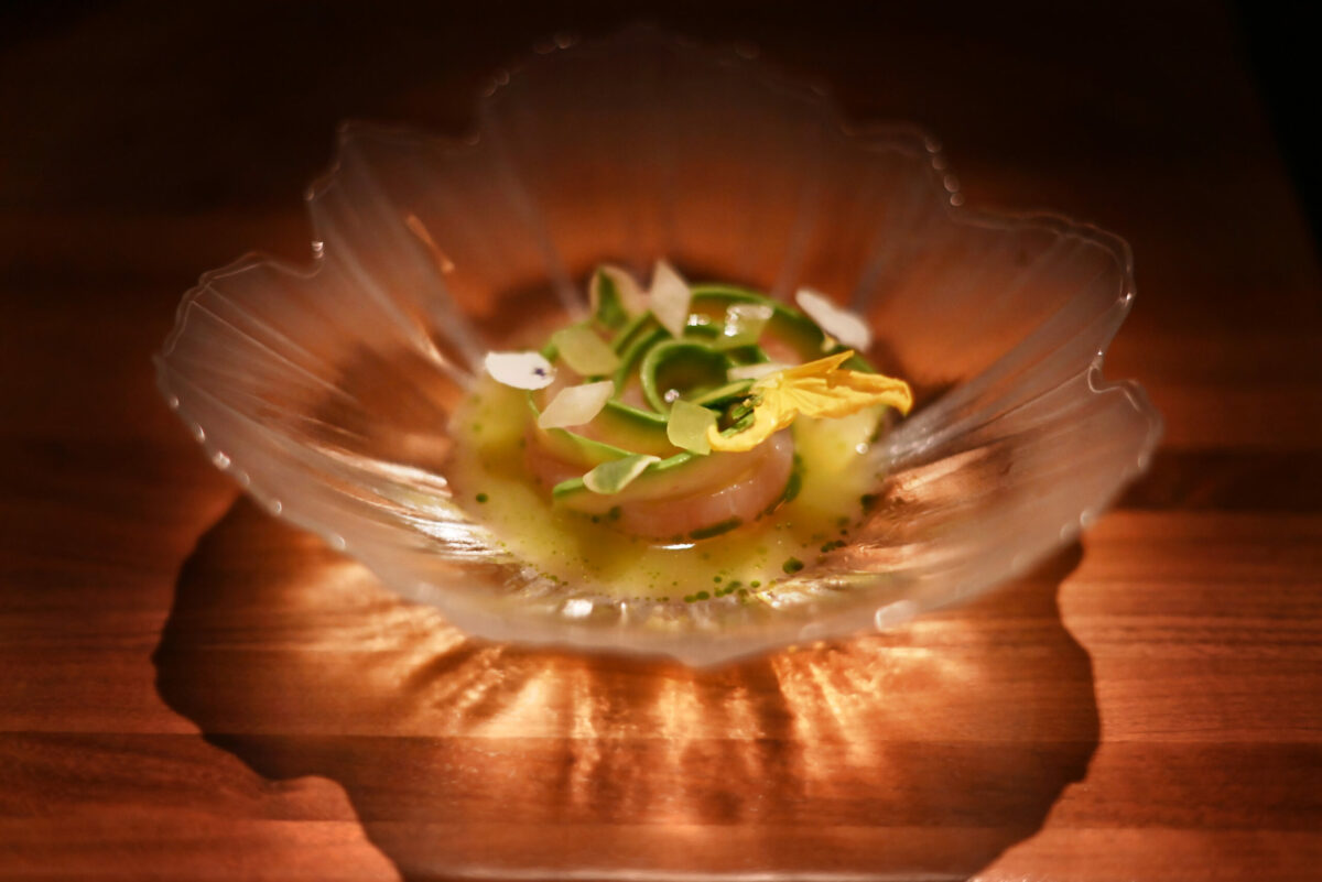 The seven-day, dry-aged Japanese Kampachi with avocado, cilantro and served in a pool of California golden kiwi aquachile at Auro restaurant in Calistoga, Calif. on Thursday, Dec. 8, 2022. (Erik Castro / For The Press Democrat)