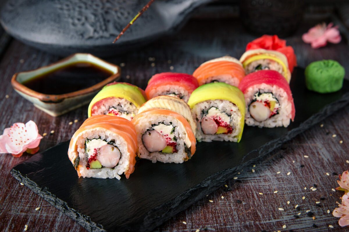 Rainbow Sushi Roll with salmon, eel, tuna, avocado, royal prawn, cream cheese Philadelphia, caviar tobica, chuka. Sushi menu. Japanese food.