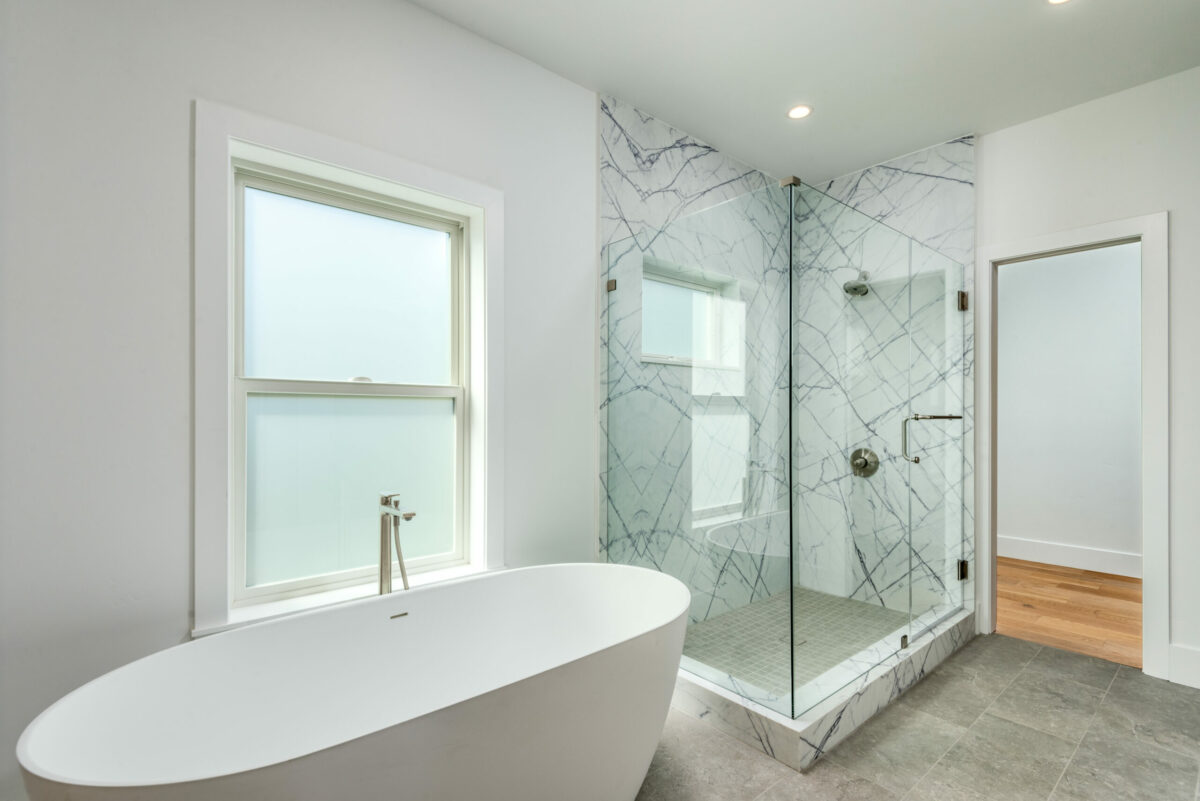 The three bedrooms have ensuite bathrooms with book-matched shower slabs. (Prosper Real Estate)