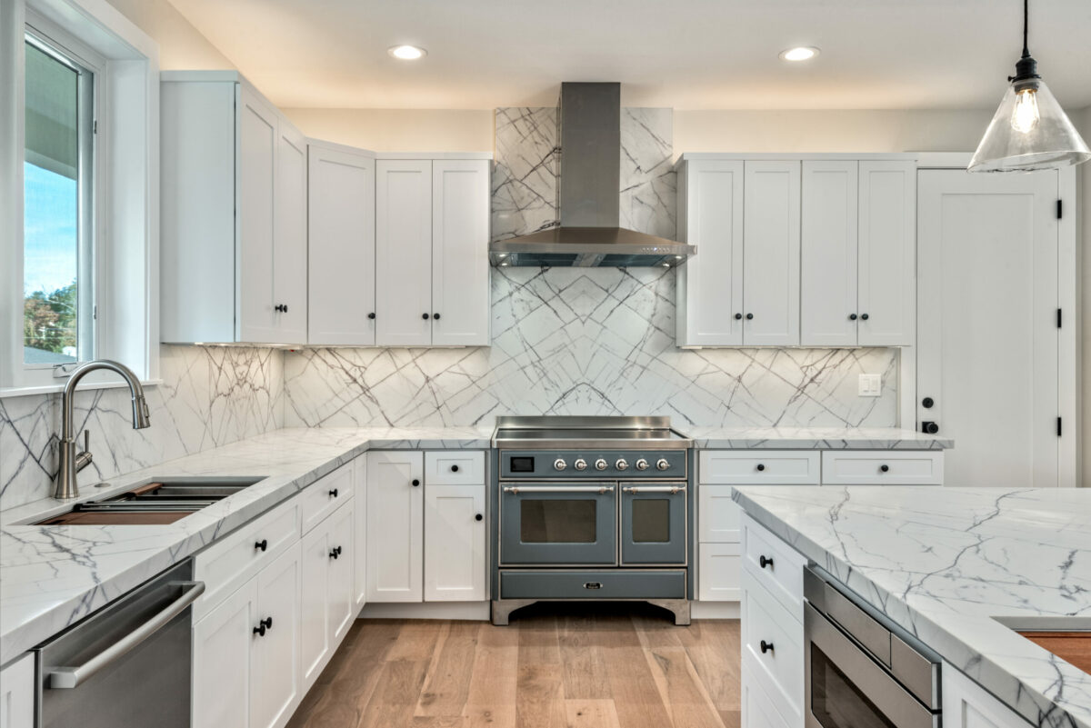 The kitchen has a live induction range and opens up to the dining area and great room. (Prosper Real Estate)