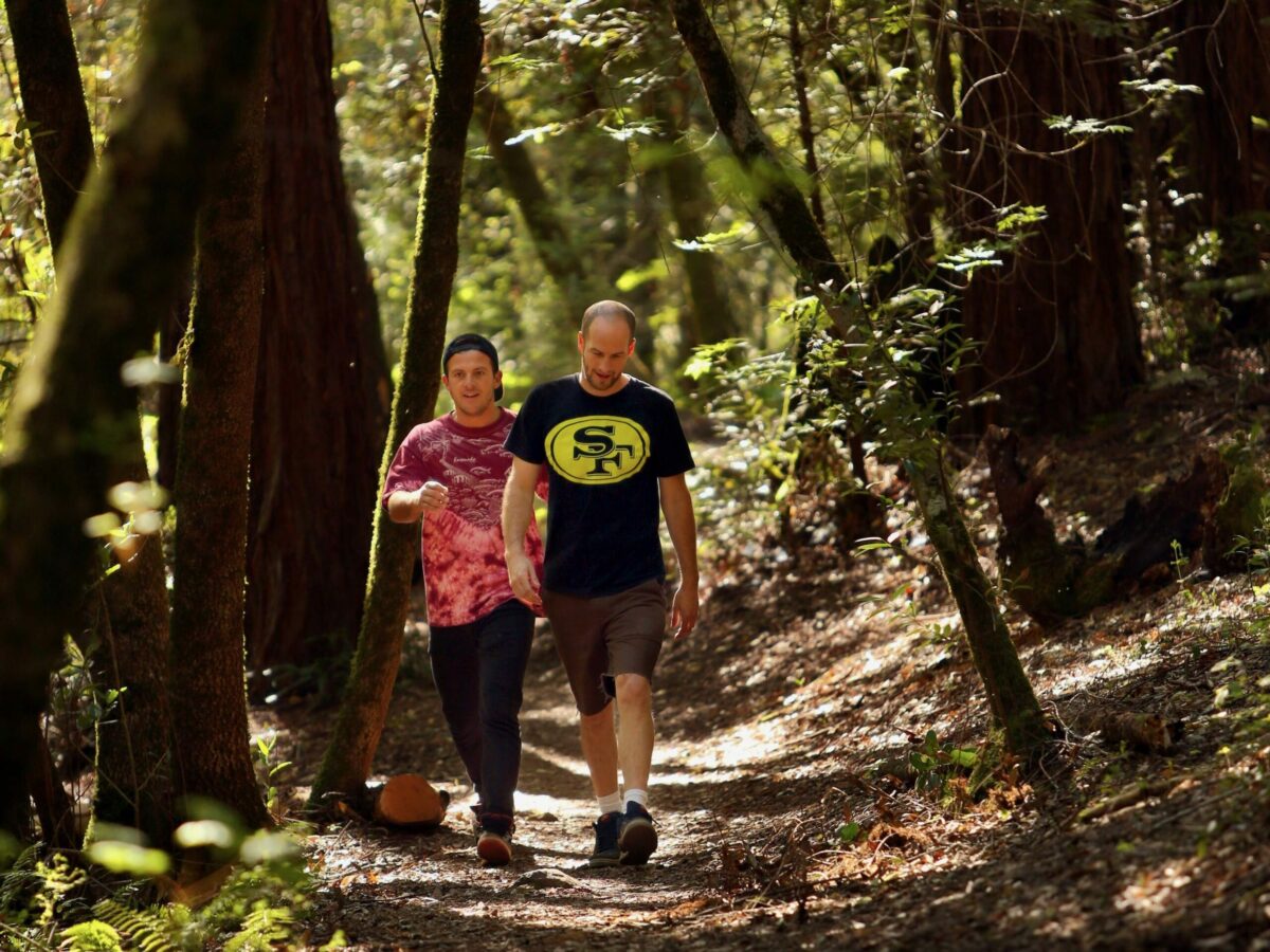 Elliot Greer, left, and Tom Free hike along the trails of Bartholomew Park in Sonoma on Wednesday, March 19, 2014. (Conner Jay/The Press Democrat)