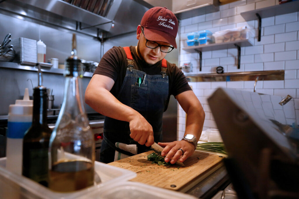 Chef Carlos Mojica Jr. was only 24 years old when he opened Guiso Latin Fusion in Healdsburg. (Alvin Jornada/The Press Democrat)