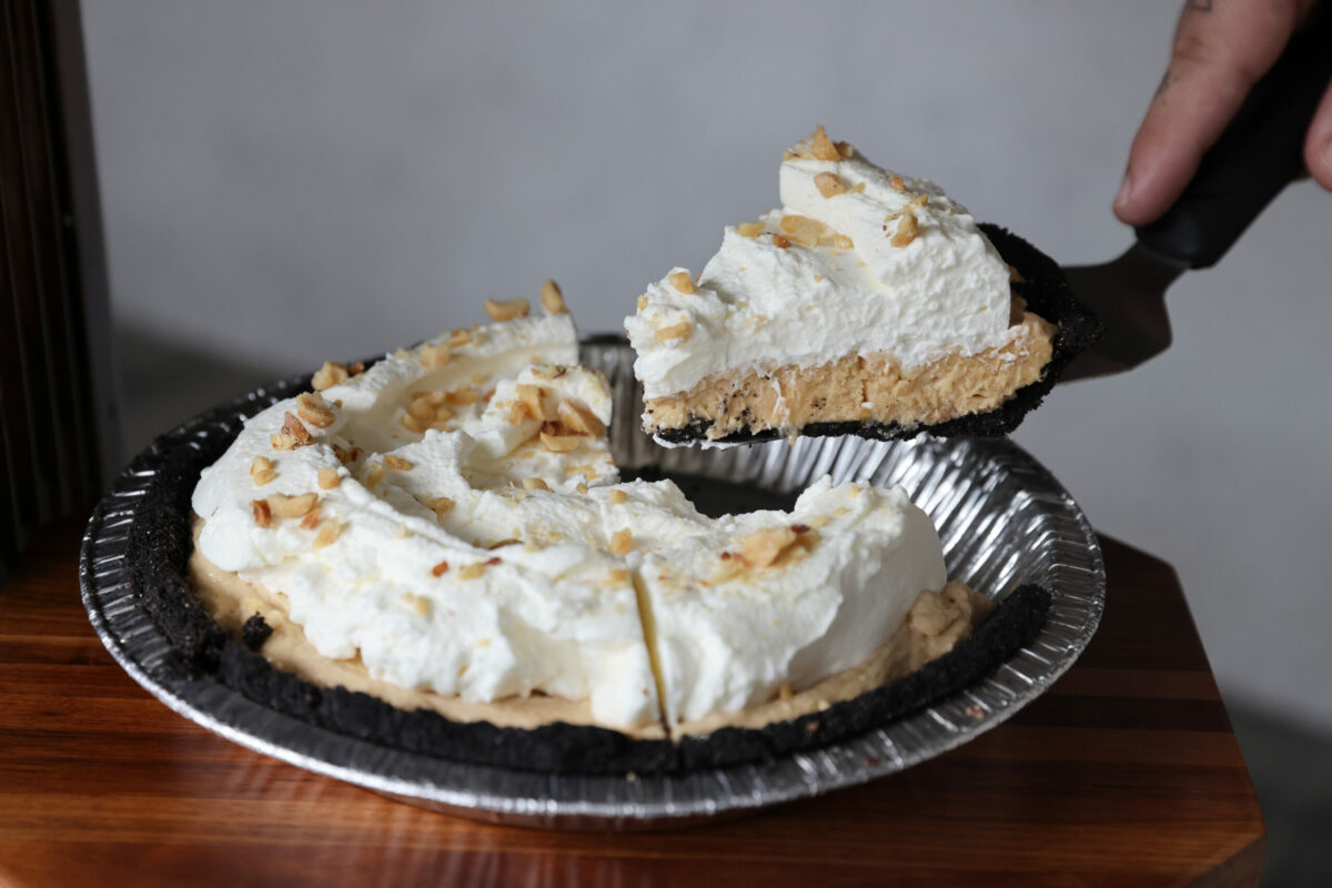 Co-owner Christian Sullberg cuts a slice of Peanut Butter Pie at Noble Folk Ice Cream and Pie Bar in Santa Rosa. (Beth Schlanker/The Press Democrat)