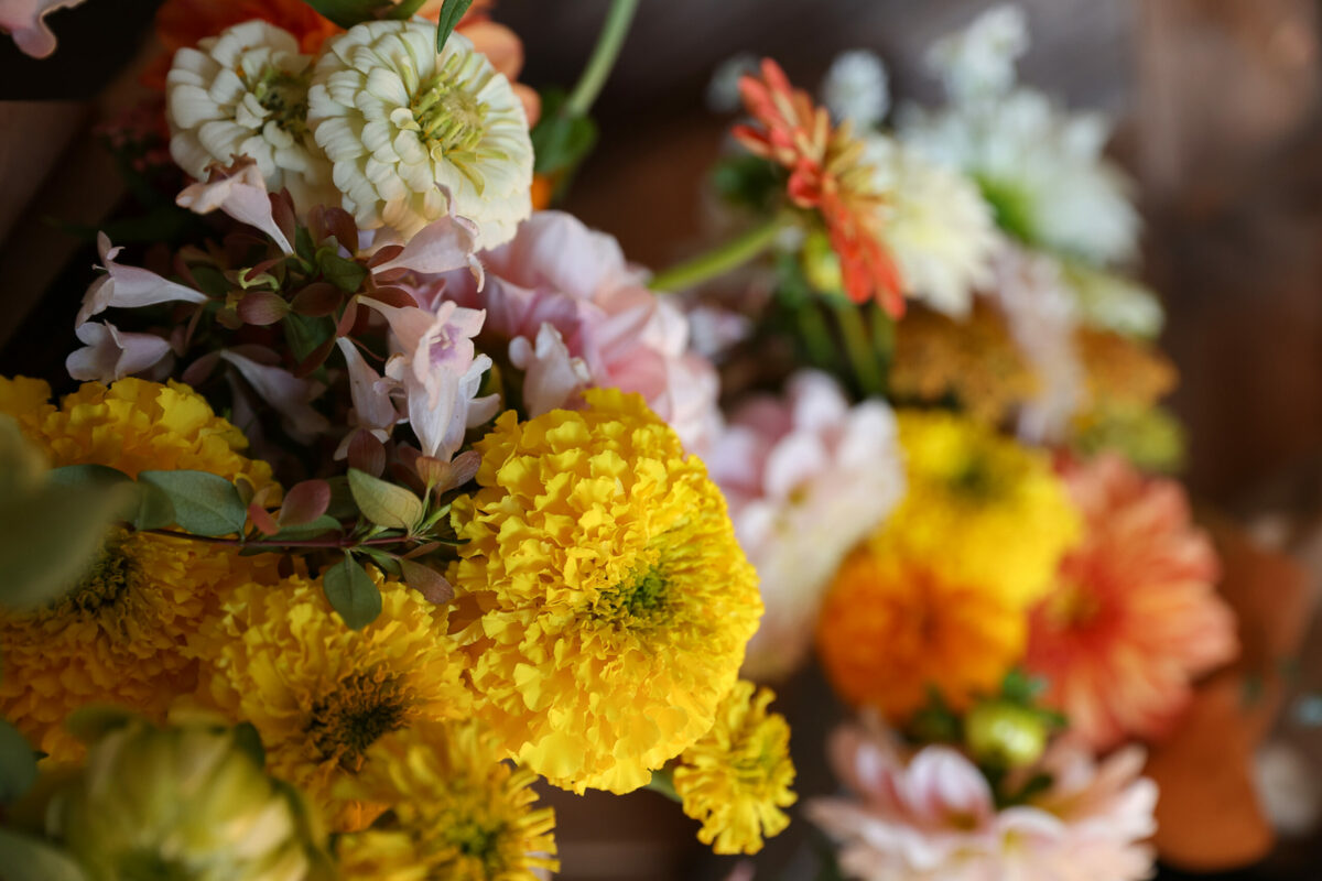 Floral arrangements including marigolds available at the Full Bloom Flower Farm and Floral Design farm stand near Sebastopol, Tuesday, Oct. 17, 2023. (Christopher Chung / The Press Democrat)