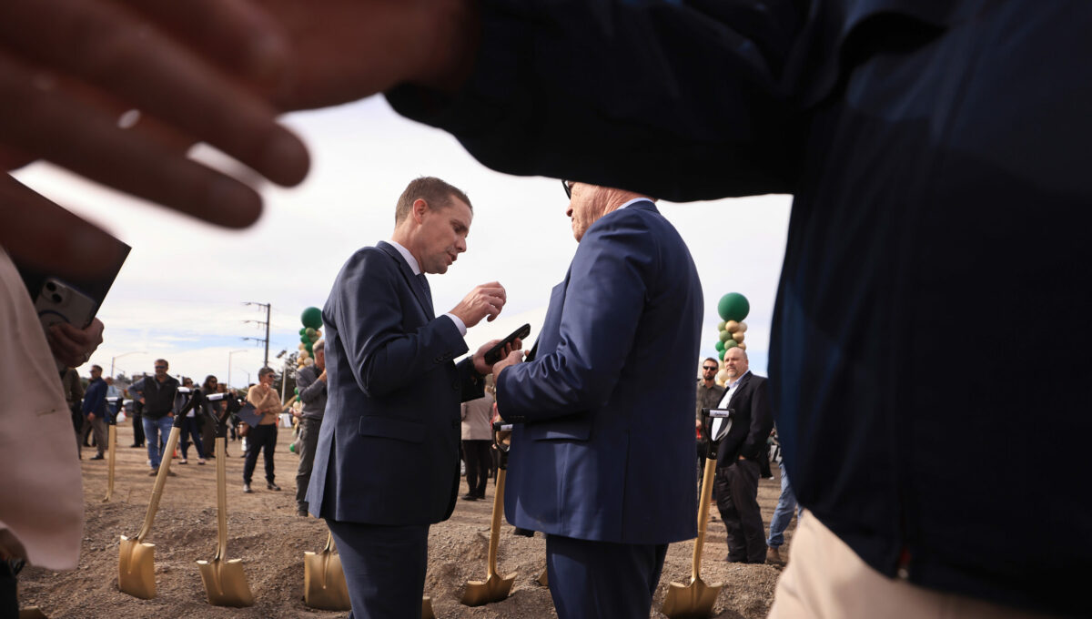 Mike McGuire, California State Majority Leader, middle left, talks with Denis Mulligan, General Manager and CEO of the Golden Gate Bridge, Highway and Transportation District.Thursday, Nov. 9, 2023 during the ground breaking of the Petaluma north SMART station. (Kent Porter / The Press Democrat) 