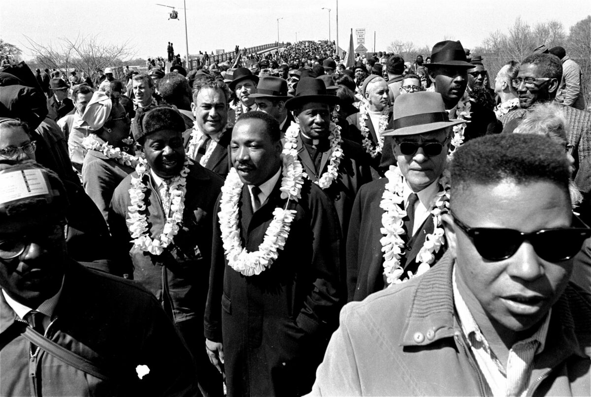 Martin Luther King, Jr. and his civil rights marchers head for Montgomery, the state's capitol, March 21, 1965 during a five day, 50 mile walk to protest voting laws. Soldiers were called out by President Johnson to protect the marchers. (AP Photo)