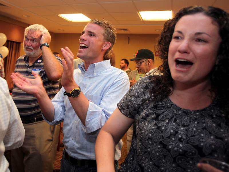 Sonoma County Supervisor candidate Mike McGuire and his fiancée Erika Fremault cheer as they watch the election results update on Tuesday night, June 8, 2010. (Press Democrat file)