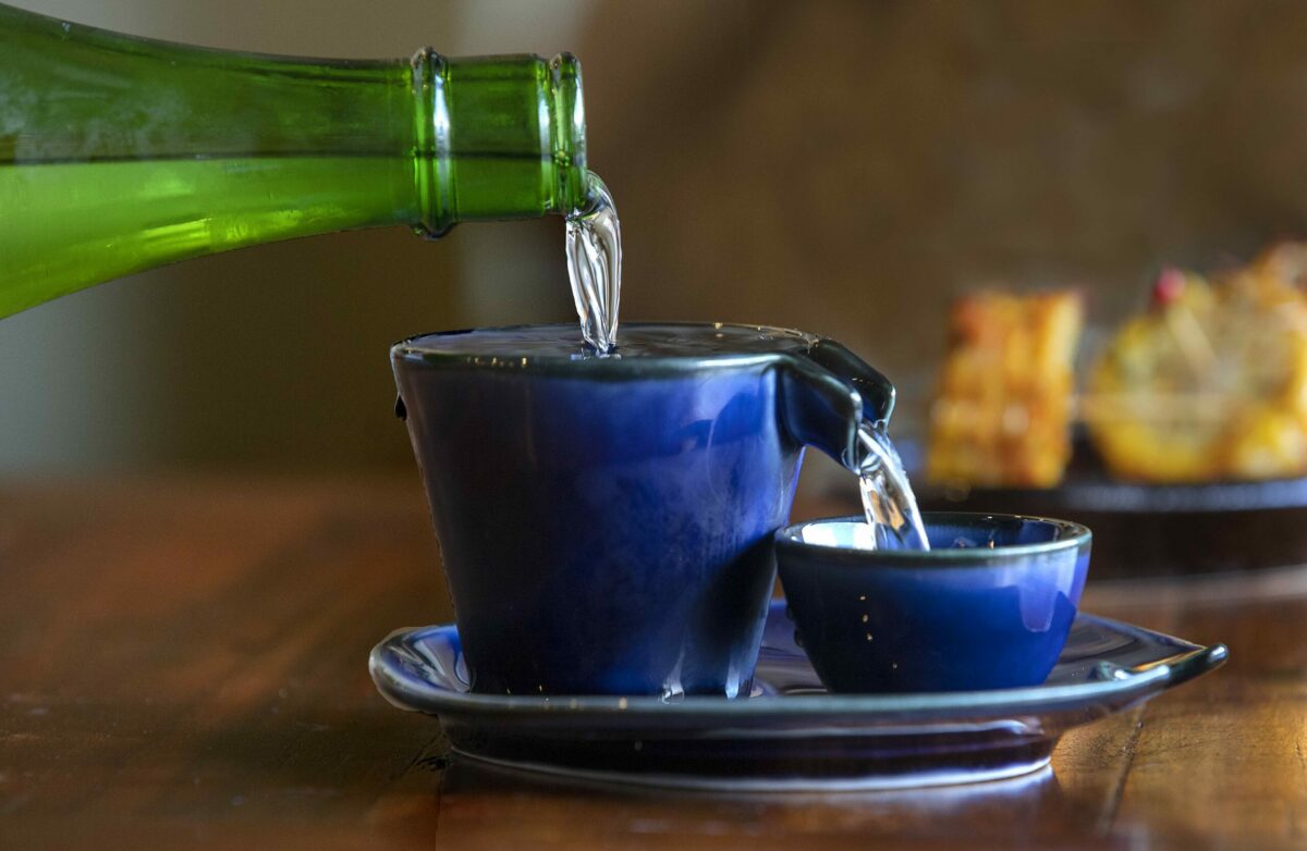 Nechi Sake poured into a vessel which overflows into a cup from Taste of Tea in Healdsburg. (photo by John Burgess/The Press Democrat)