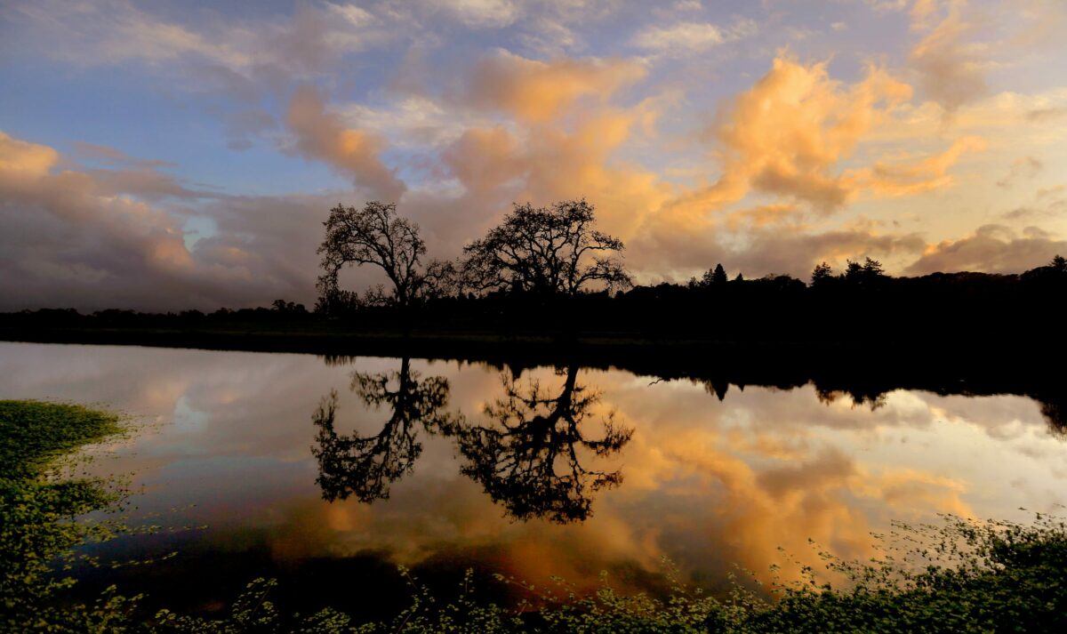 A spring storm breaks apart at sunset at the Laguna de Santa Rosa. (Kent Porter / The Press Democrat)