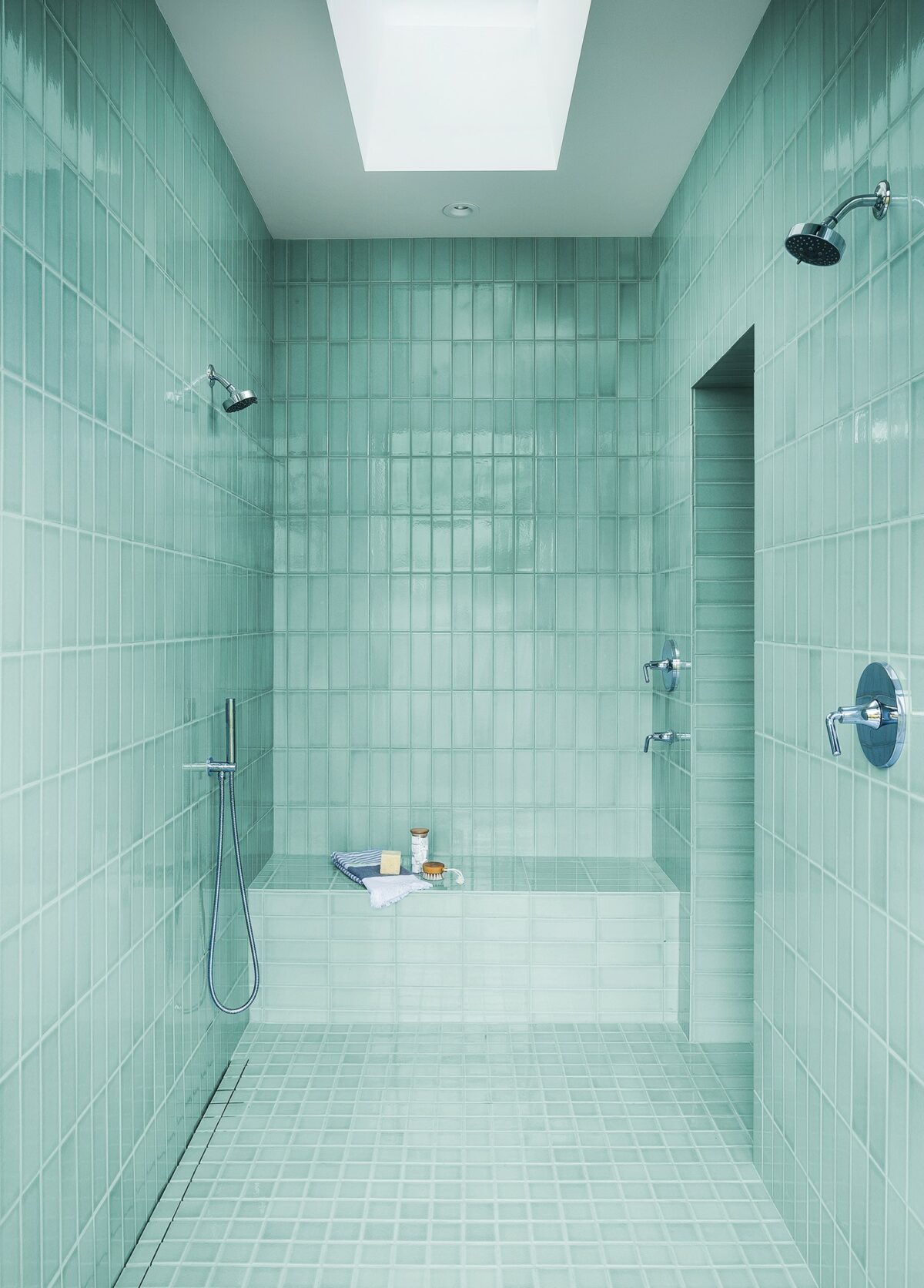 Although the guesthouse’s shower tile is a saturated color, the disciplined layout and restrained design keeps the feel wonderfully tranquil. (Adam Potts Photography)