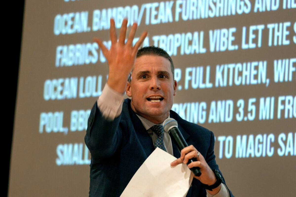 State Senator Mike McGuire acting as auctioneer, encourages bidders for a benefit auction on stage during the Hawaiian luau themed, Russian River Rotary’s 37th Annual Crab Feed, at Friedman Events Center, in Santa Rosa, Saturday, January 20, 2024. (Darryl Bush / For The Press Democrat)