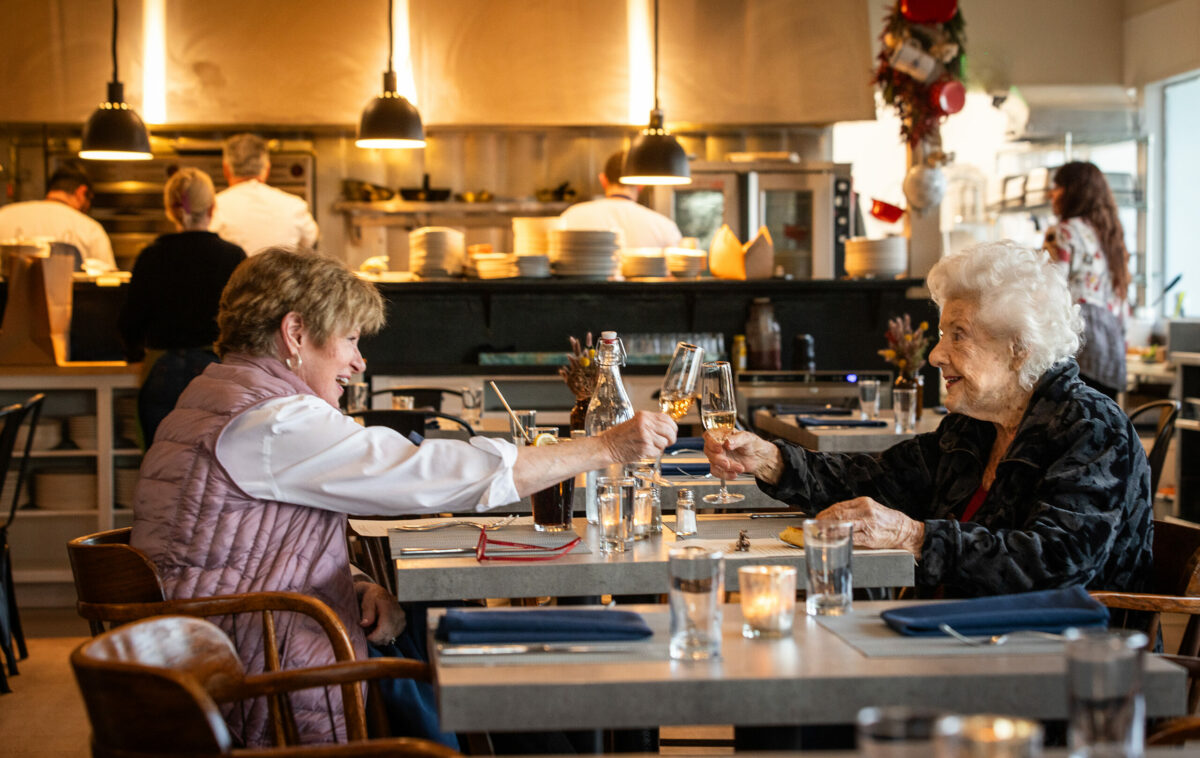 Healdsburg residents Millie Frisch, left, and Marijana Sander toast with champagne before dinner at Tisza Bistro Monday, February 12, 2024 in Healdsburg. (Photo by John Burgess/The Press Democrat)