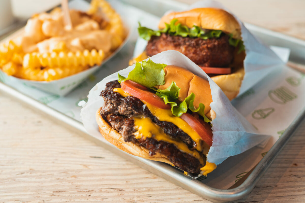Double cheeseburger with tomato and onion from Shake Shack. (Manu Padilla/Shutterstock)