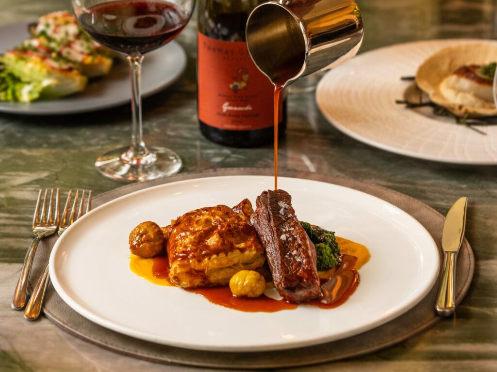 Liberty Farms Duck Breast with leg en croute, koginut squash, roasted chestnuts, rapini and a l’orange jus from the Dry Creek Kitchen Thursday, November 2, 2023, in Healdsburg. (John Burgess/The Press Democrat)