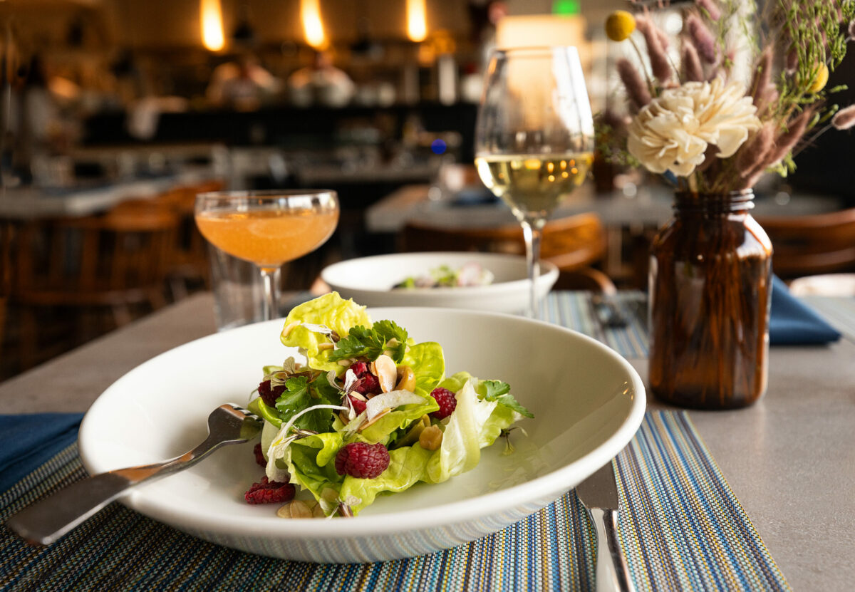 Boston Bibb salad with sundried tomato, garbanzo beans, raspberries and tarragon Dijon vinaigrette from Tisza Bistro chef/owner Krisztian Karkus Monday, February 12, 2024 in Healdsburg. (Photo by John Burgess/The Press Democrat)