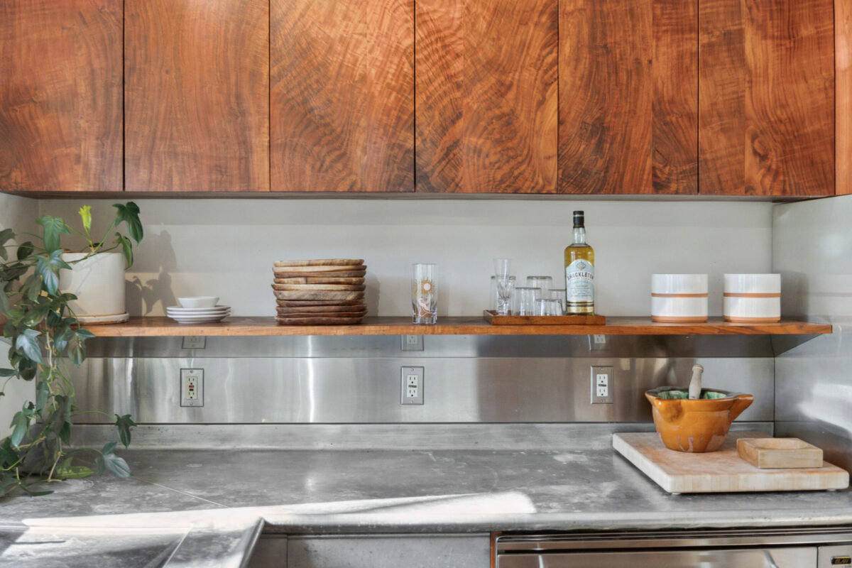 The chef's kitchen has custom walnut cabinets. (Compass)