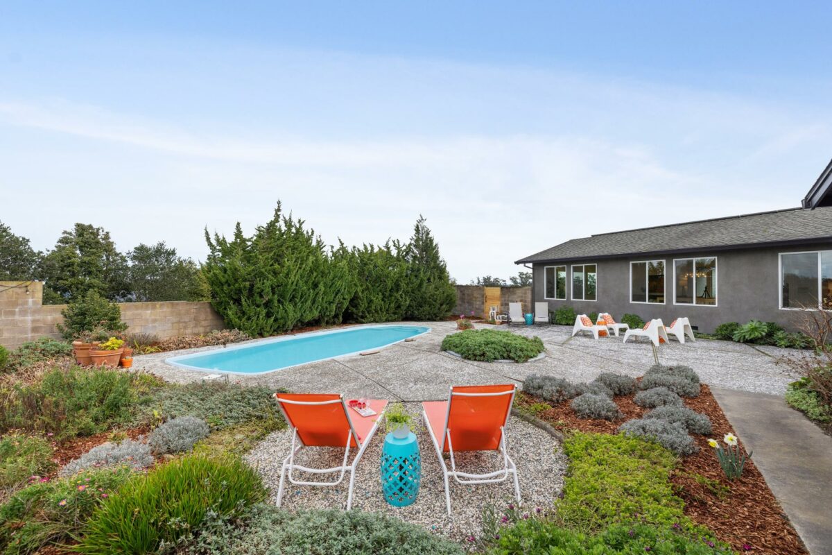 Backyard with swimming pool. (Compass Realty)