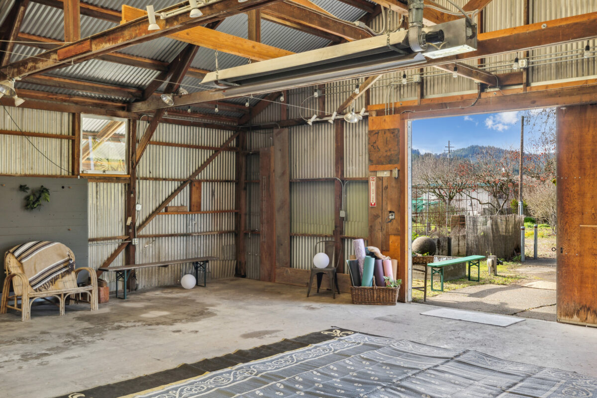 The barn, the former retail space for The Gardener in Healdsburg, is being used by a nonprofit for yoga classes. (Compass)