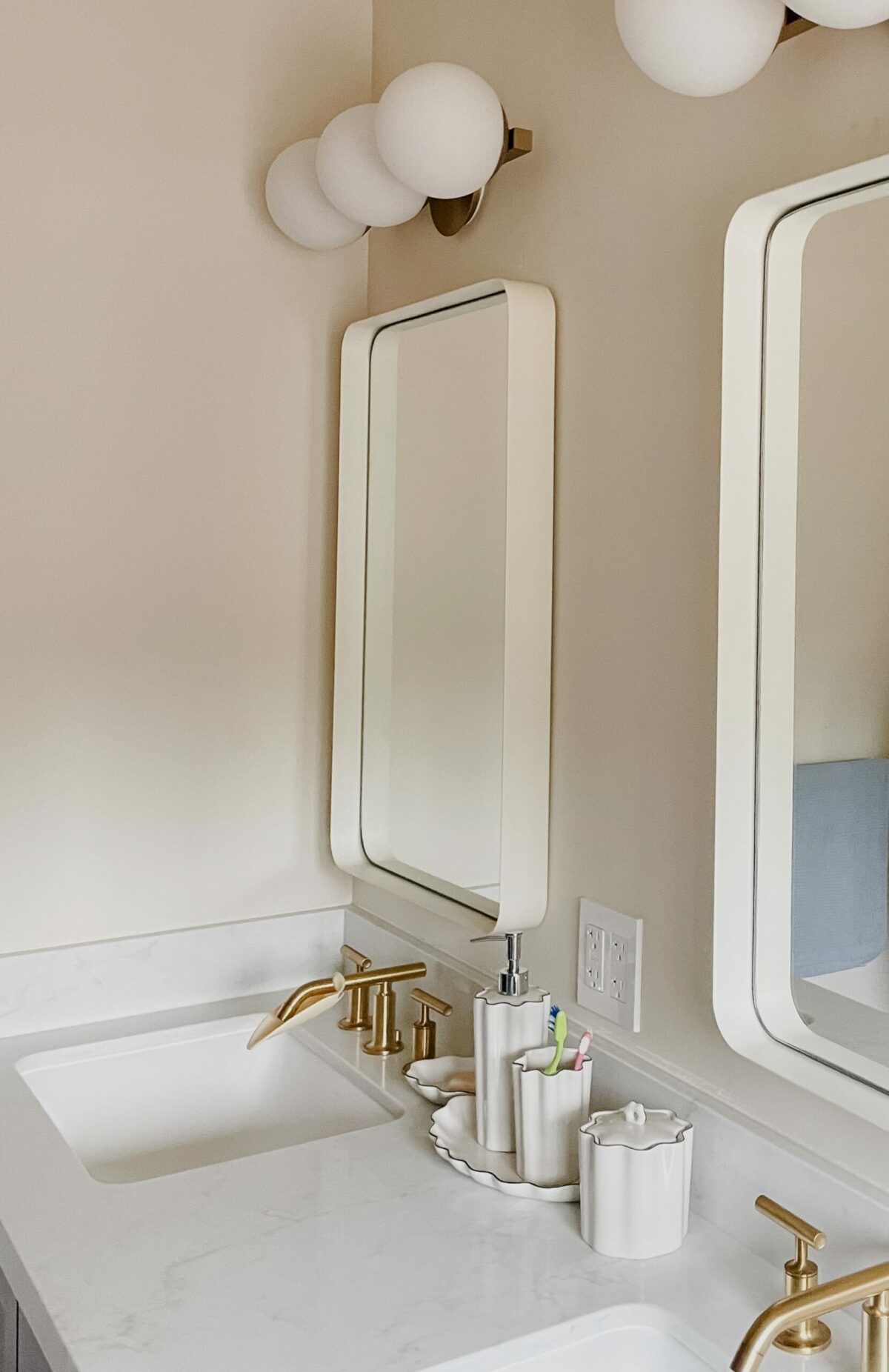 This children’s bathroom by Stephanie Meyer of AVCO Design gets a quiet shot of whimsy from a few scalloped accessories. (Courtesy of AVCO Design)