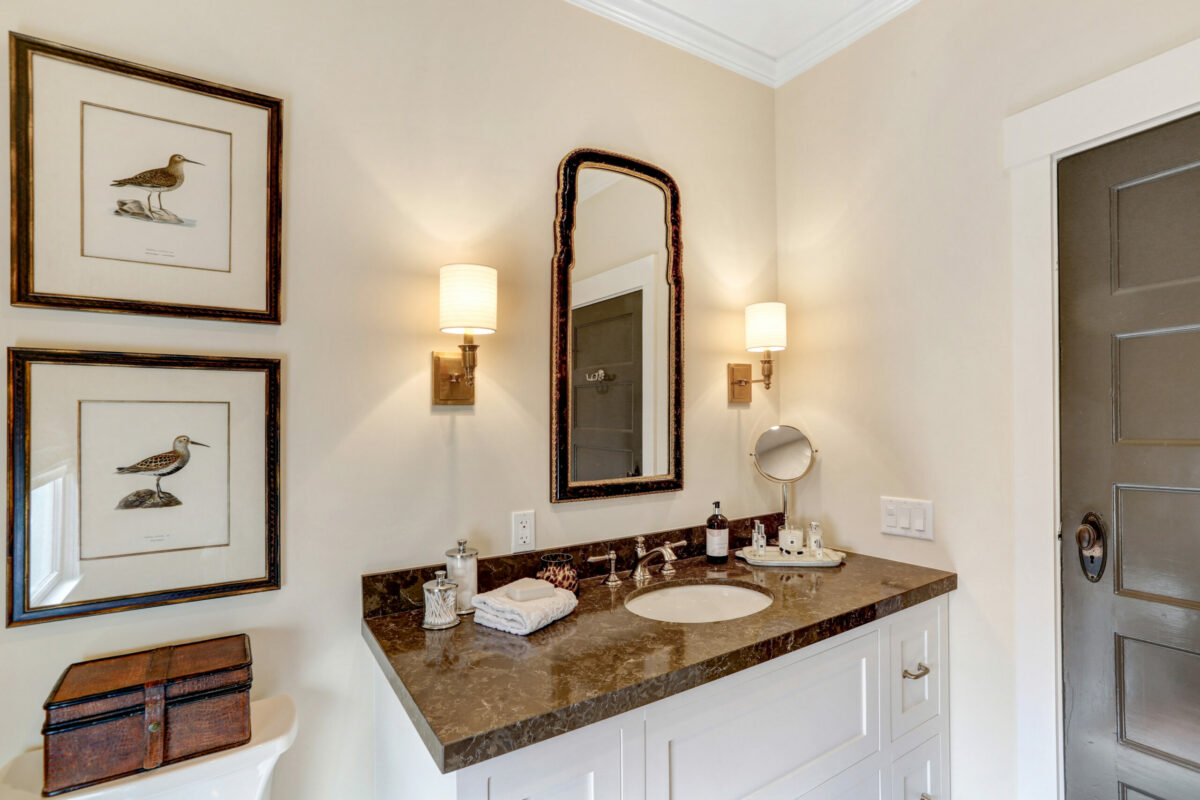 Here’s more traditional ornamentation in the bathroom, but “coffee” colors keep things serene. (Courtesy of SDL Residential)