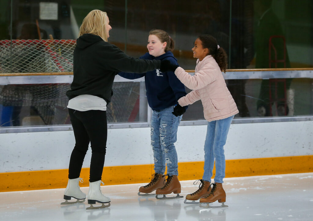 Amy Fazzini, left, skates with her daughter, Faith, 9, and Crystal Haskins, 10, during the public skate session at Snoopy's Home Ice Redwood Empire Ice Arena in Santa Rosa on Wednesday, June 23, 2021. (Christopher Chung/ The Press Democrat)