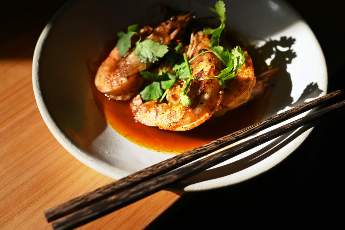 Wood fired wild head on prawns, silk road spices, shallots and olive oil at Slanted Door in Napa, Thursday, Feb. 22, 2024. (Erik Castro / For The Press Democrat)