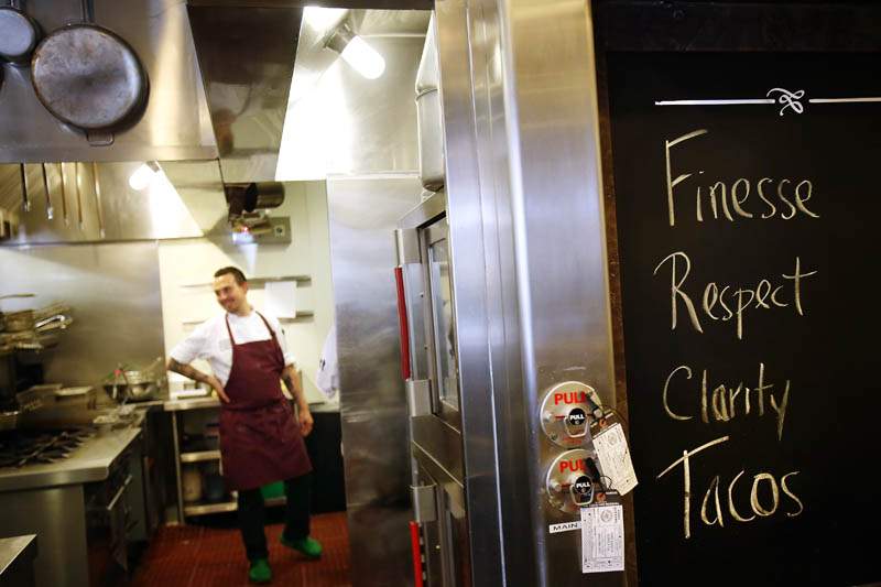 Chefs at the Chalkboard Restaurant waits to open before dinner in Healdsburg on Tuesday, June 11, 2013. (Conner Jay/The Press Democrat)
