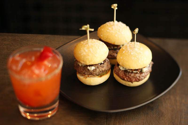 Three beef sliders are served at the Chalkboard Restaurant in Healdsburg on Tuesday, June 11, 2013. (Conner Jay/The Press Democrat)