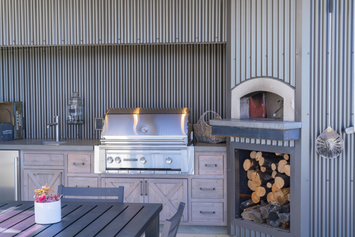 The outdoor kitchen has a pizza oven and dining area. (Ned Bonzi / Sotheby’s International Realty)(Ned Bonzi / Sotheby’s International Realty)