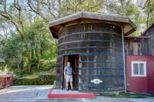 Winemaker Bart Hansen of Glen Ellen’s Dane Cellars outside his 120-year-old redwood wine tank. (James Joiner/For Sonoma Magazine)