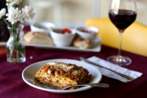 Bolognese lasagna made with 12 layers of spinach pasta, rags and béchamel sauce at Portico in Sebastopol, Wednesday, April 24, 2024. (Beth Schlanker / The Press Democrat)