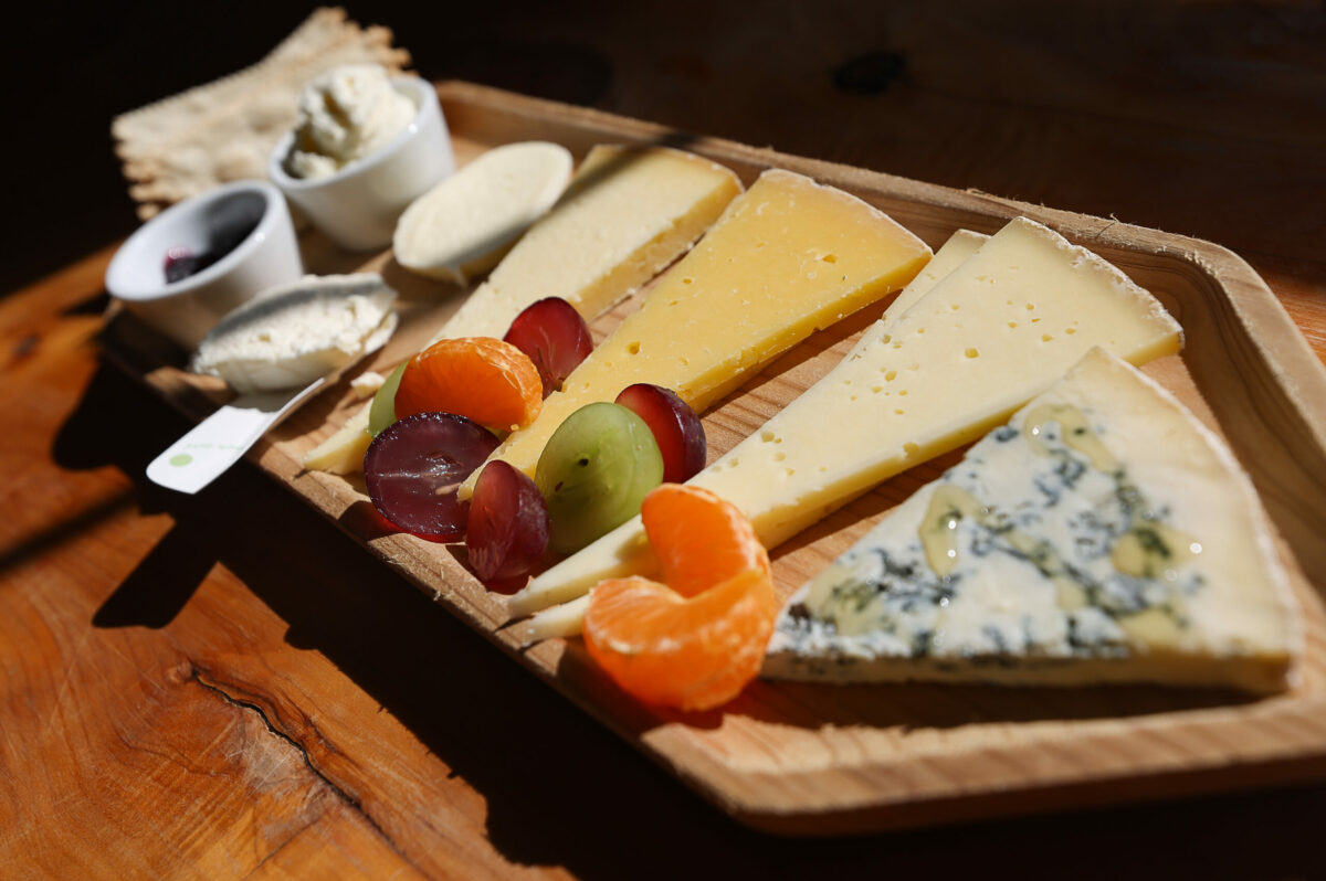A cheese flight at Valley Ford Cheese & Creamery includes Grazin’ Girl gorgonzola, Estero Gold, Estero Gold Reserve, Highway 1 Fontina, fresh mozzarella, fresh ricotta, and plain farmer’s cheese, in Valley Ford. (Christopher Chung / The Press Democrat)