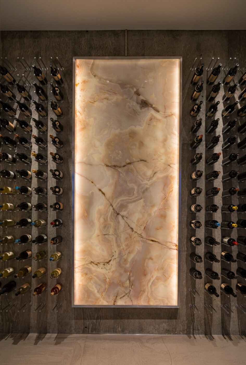 The wine cellar has an illuminated onyx walll. (Adam Potts)