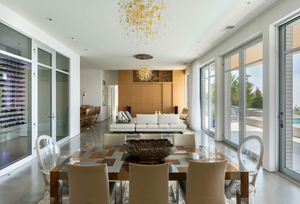 The home has exquisite interior elements like glass blown chandeliers and teak cabinetry. (Adam Potts)