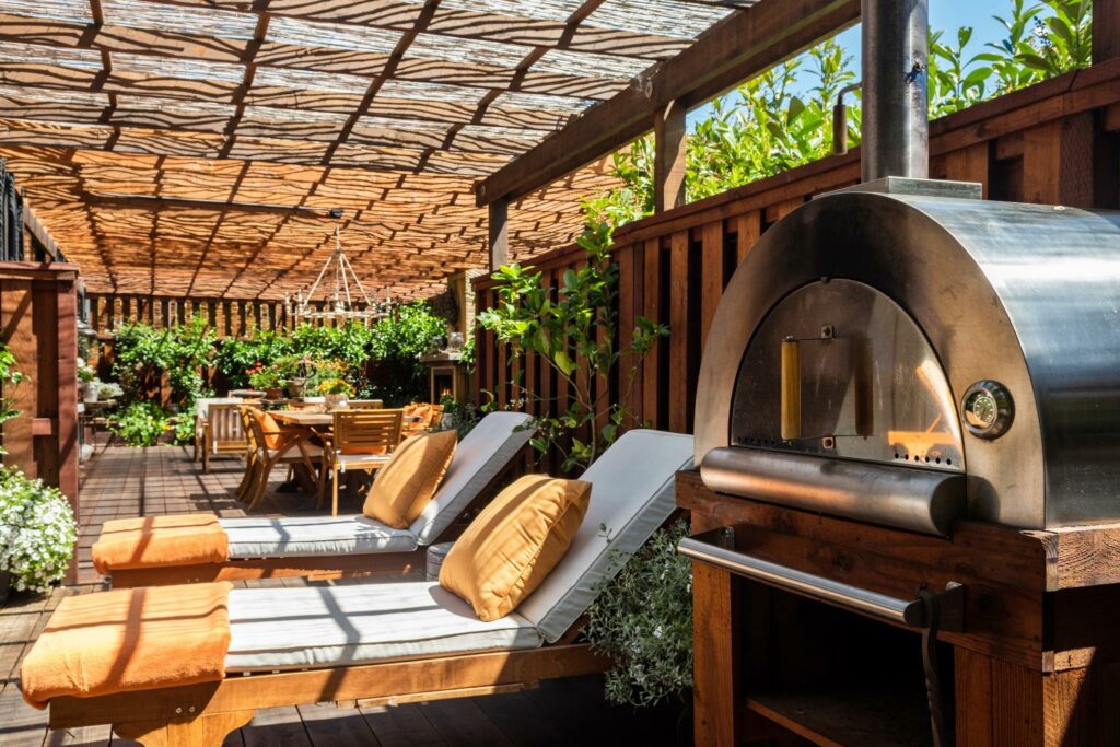 Lounge area and pizza oven. (Open Homes Photography)