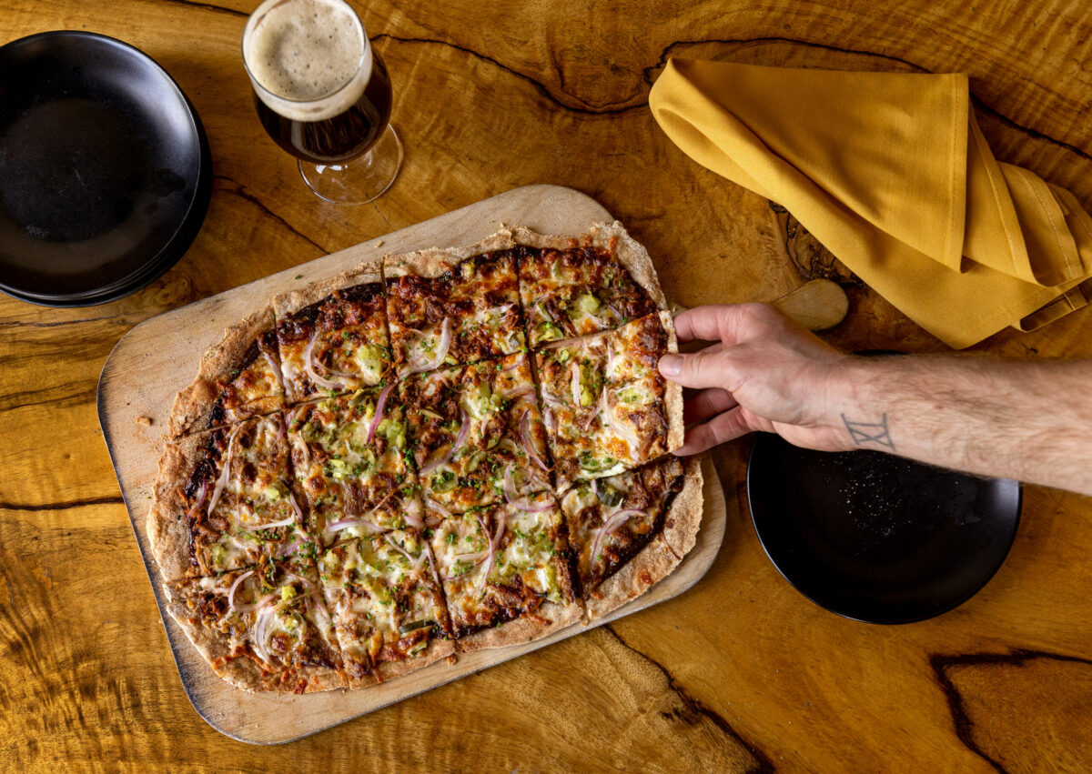 The Texas BBQ Flatbread with pulled pork, house bbq sauce, onion, cheddar and pickles from Road Trip Monday, May 20, 2024, in Guerneville. (John Burgess/The Press Democrat)