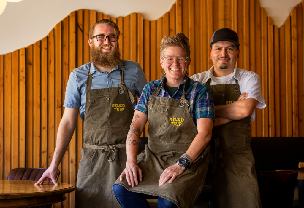 The team at Road Trip in Guerneville, from left, beverage director Douglas Thomas, executive chef Crista Luedtke and chef de cuisine Carlos Mendez Monday, May 20, 2024 in Guerneville. (John Burgess/The Press Democrat)