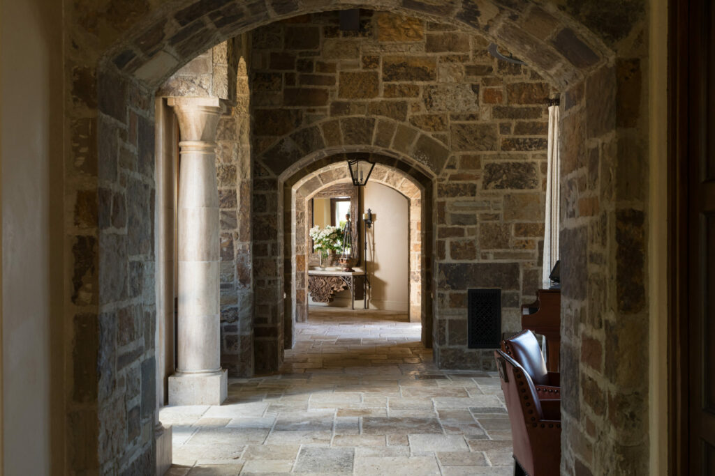 The 11,000 square foot dwelling has stone walls and arched doorways. Limestone floors throughout were harvested from a French monastery.(Peter Lyons)